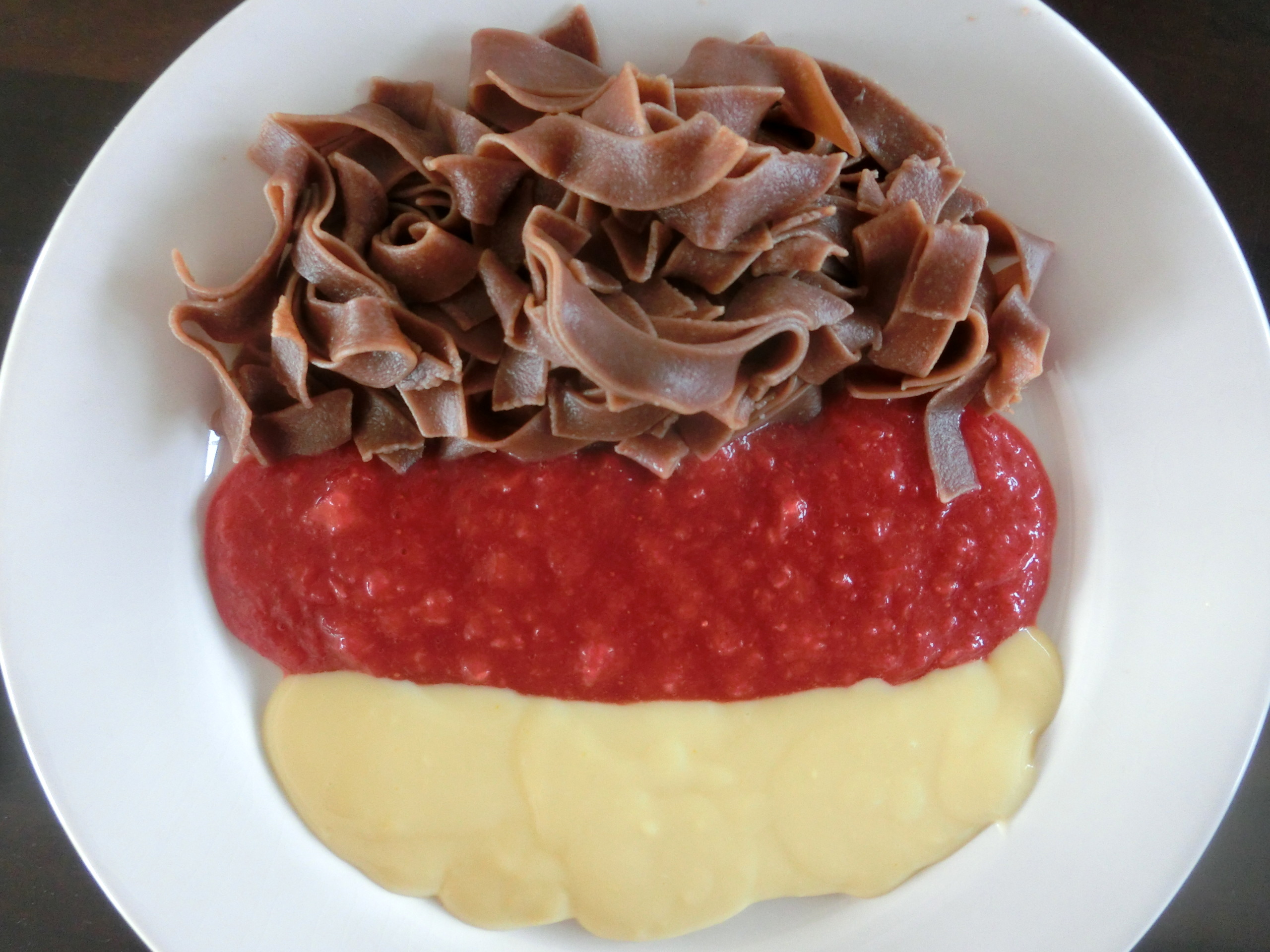 WM fever with chocolate pasta, strawberry and vanilla sauce